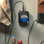 hardware_adding_a_power_jack_to_a_battery_powered_dremel_charger_base_up_on_the_wall.png