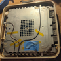 hardware_breaking_out_apple_airport_express_antennas_dismantling_top_shield.png