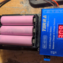 hardware_creating_an_analog_rc_drone_with_remote_headset_battery_and_charger_mounted_together.png